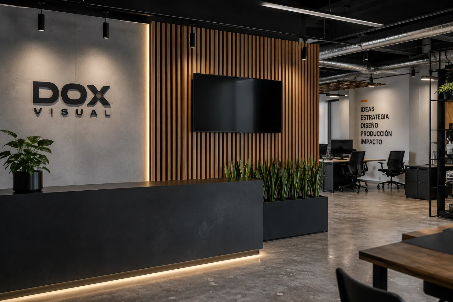 Decoración corporativa DOX Visual: branding de oficina con letras 3D y panel de madera en recepción.